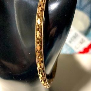 Gold tone bangle bracelet with engraving.  Vintage.  Bme2811